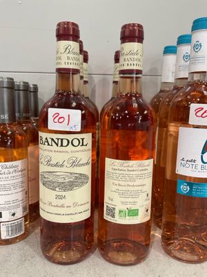 several bottles of alcohol are lined up on a counter