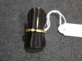 a ring that is sitting on top of a black object