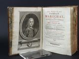 an old book with a picture of a man in a suit and tie