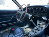 a car with a steering wheel and a dash board in it
