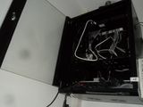 a black computer case with wires and wires in it