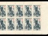 a black and white photo of a group of stamps on a sheet of paper