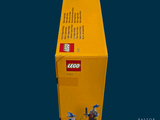 a box of legos sitting on a blue surface