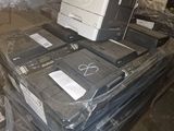 a pile of computer equipment sitting on top of a pile of plastic