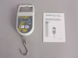 an image of a digital scale with a hook