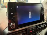 a picture of a cell phone in the center of a car