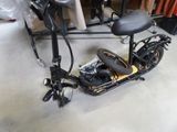 a scooter that is sitting on the floor in a room