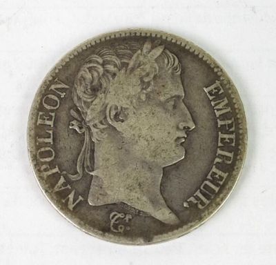 a close up of a coin with a woman ' s face on it