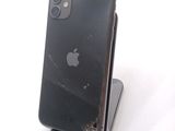 a broken iphone sitting on top of a phone stand