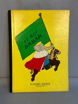 Le livre est jaune et comporte l'image d'un homme à cheval.