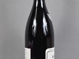 a bottle of wine that is sitting on a table