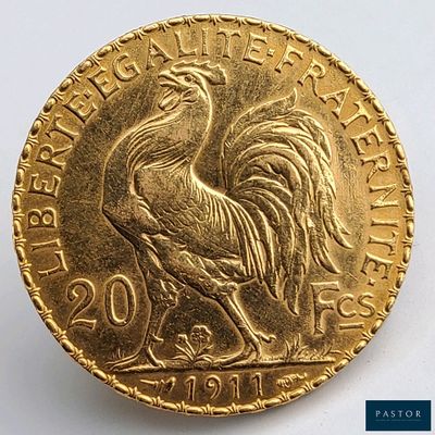 l'image d'une pièce d'or ornée d'un coq