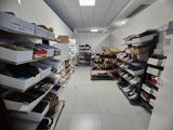 a room with a lot of shoes on the shelves
