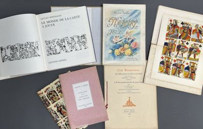 several books are sitting on top of a table next to each other