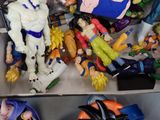 a box full of action figures that are sitting on a table