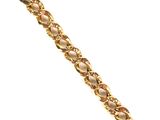 a close up of a gold bracelet on a white background