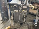 a machine that is sitting on the ground in the garage