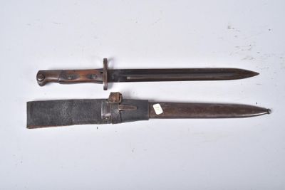two knives that are laying on a white surface