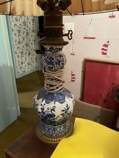 a lamp that is sitting on a table in a room