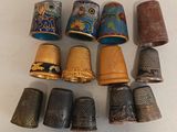 several different types of thimbles are lined up on a table