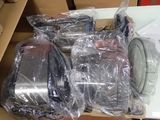 several pieces of luggage sitting on top of a table covered in plastic