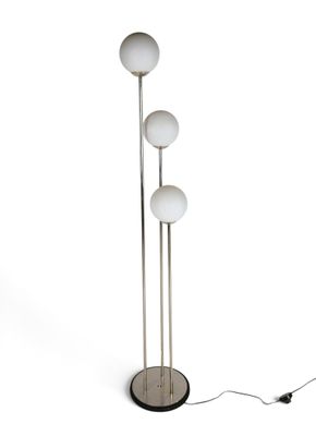 an image of a floor lamp with three balls on it