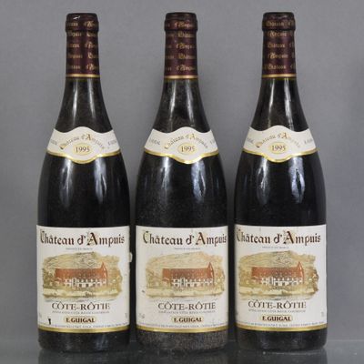 three bottles of wine sitting on top of a glass table
