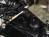 a lot of wires and cords on the desk