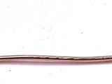 a pearl on a stick on a white surface