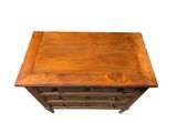 a wooden chest of drawers on a white background