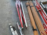 a lot of skis and ski poles on the ground