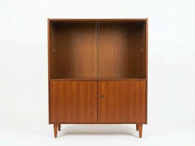 a wooden bookcase with two doors and two drawers
