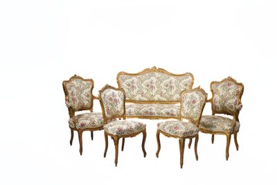four chairs and a couch in a room