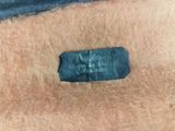 an image of a close up of a piece of clothing with a label on it