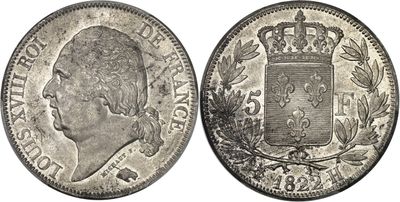 a silver coin with a crown on the front and a crown on the back