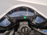 a close up of a motorcycle ' s dashboard with a speedometer