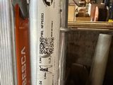 a close up of a metal pole with a sticker on it