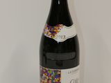 a bottle of wine that has sprinkles on it