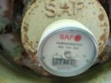 a close up view of a gas meter with rust on it