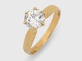 une bague sertie d'un seul diamant, signée Cartier