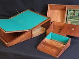 three wooden boxes that are sitting on a table