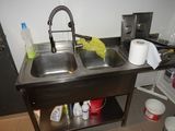 a sink with two sinks in it in a kitchen
