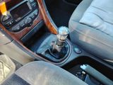 a close up of a car ' s interior with a gear stick
