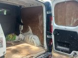 a white van with the door open on the side of the road