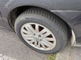 a car that has a tire that is on the side of the road