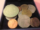 a box with a bunch of coins in it