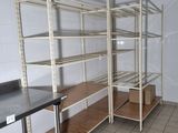 a room that has a bunch of shelves in it