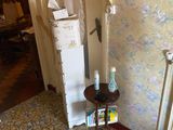 a small table in the corner of a room with a radiator