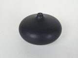 an image of a small black object on a white surface