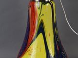 an image of a colorful lamp with a white bulb on it